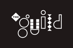 The words THE guild are displayed in a creative, geometric font on a black background, with each letter of guild formed using unique shapes like circles, squares, and diamonds.