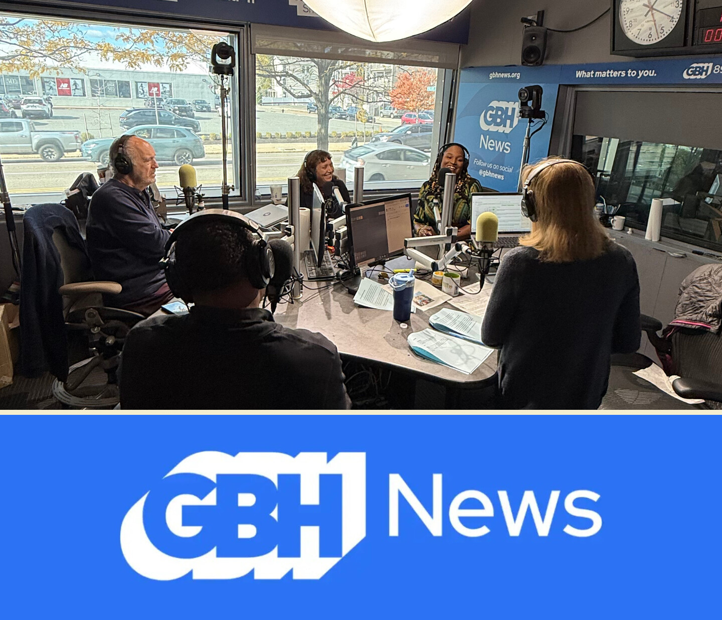 Four people are seated around microphones in a GBH News radio studio, engaged in conversation. Large windows reveal a street outside. Below, the blue GBH News logo is displayed.